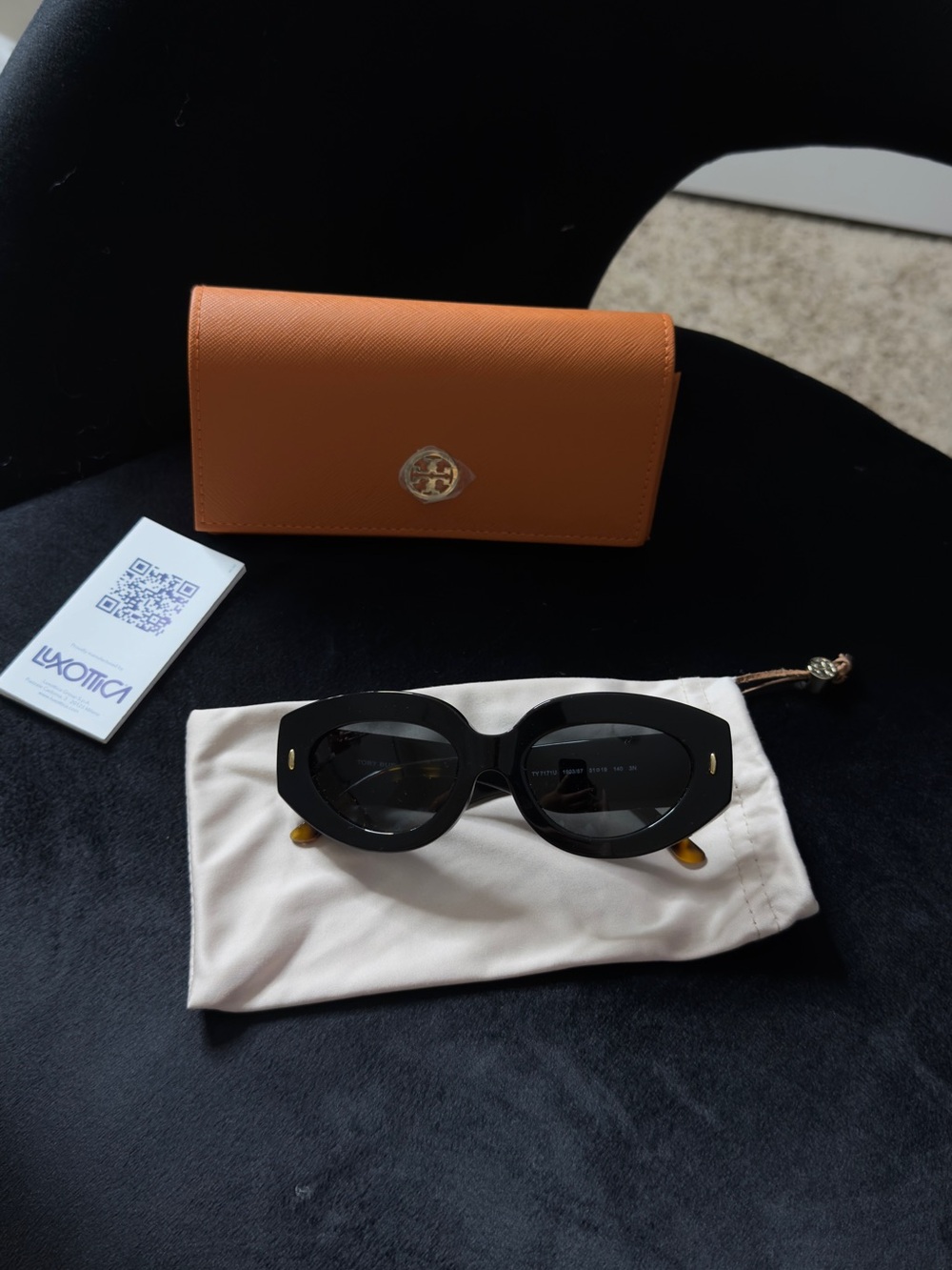 Tory Burch Black Oval Sunglasses with Orange Case